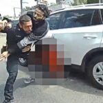 Suspect Goes For Officer's Gun After Being Struck During Shootout