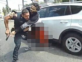 Suspect Goes For Officer's Gun After Being Struck During Shootout