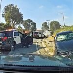 Suspect Shot After Slamming BMW Into Police Cruisers And Aiming Gun