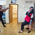 Officer Opens Fire As Suspect Takes Woman Hostage